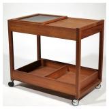 MID CENTURY DANISH TEAK BAR CART | Having 2 shelves, small drawer, and movable top shelf revealing l
