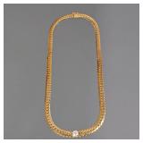 14K GOLD RIBBON PIN | Designed as a textured yellow gold ribbon-form brooch, with fineness mark to b