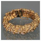 ST. GEORGE 18K GOLD & DIAMOND BRACELET | 18k yellow gold flexible link bracelet, set with 55 diamond