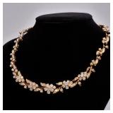 FRENCH DIAMOND & 18K GOLD VINE NECKLACE | Designed as a graduated pattern of 18k gold figured leafy 