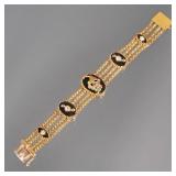 14K GOLD & MULTI-GEM STATION BRACELET | Designed as 4 flexible yellow gold box link chains connected