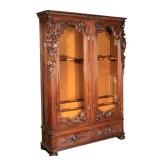 MONUMENTAL ANTIQUE BLACK FOREST CARVED GUN CABINET | Probably late 19th century, having a flat top w