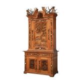 BLACK FOREST CARVED HUNT CABINET | 20th century, crested with a carved dogs head h. 106 x w. 56 x d.