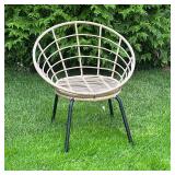 ROUND OUTDOOR RATTAN CHAIR | Features a round, open-weave rattan-style seat and black metal legs. . 