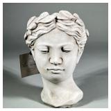 CLASSICAL BUST PLANTER, COMPOSITION | Composition planter i the form of a female bust with laurel le