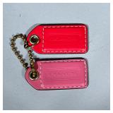 (2pc) COACH LEATHER HANG TAGS | Two pink leather hang tags on a single ball chain. Dimensions: w. 2.