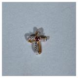 Sterling & Gemstone Cross Pendant | A gold-tone sterling silver looped cross pendant mounting a hear