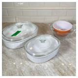 (5pc) Pyrex Mixing Bowls And Covered Casserole Dishes | 2 clear smaller mixing bowls, one orange sma