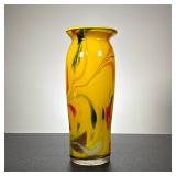 Tall Art Glass Vase | A colorful art glass vase with red and green swirls on a yellow ground; no app