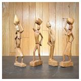 (4pc) African Carved Wood Figures | Including three figures carrying baskets Dimensions: h. 11.25 in