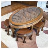 Carved Chinese Style Low Table | Heavily carved with an insect glass top and having six nesting conf