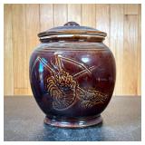 Dark Brown Ceramic Lidded Jar | With lobster scene on front. Dimensions: h. 9 x w. 8 x dia. 6 in (Di