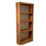 WOOD BOOKCASE WITH NEWSPAPER-BACKED INTERIOR | Freestanding, tall narrow wooden bookcase with four f