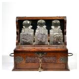 AN OAK & CRYSTAL ANTIQUE TANTALUS