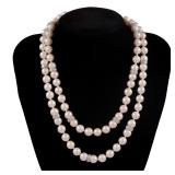 LONG STRAND OF PEARLS WITH PLATINUM & DIAMOND STATIONS