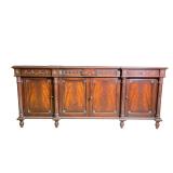 NEOCLASSICAL-STYLE MAHOGANY SIDEBOARD WITH CARVED SWAGS AND FLUTED COLUMNS