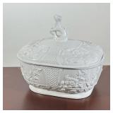 WHITE RELIEF-MOLDED PORCELAIN TUREEN WITH DOG-FORM FINIAL