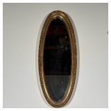 OVAL GILT COMPOSITION BEVELED MIRROR