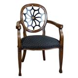 HEPPLEWHITE-STYLE SPIDER-BACK ARMCHAIR WITH GILT ROSETTES | Oval spider-wheel back with black-painte