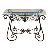 WROUGHT IRON CONSOLE TABLE WITH BEVELED GLASS TOP | Wrought iron console table with an ornate scroll