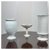 (3pc) LENOX PORCELAIN VASES AND STEMMED COMPOTE | Group of three white glazed porcelain pieces: two 