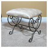 UPHOLSTERED VANITY BENCH WITH WROUGHT IRON SCROLL BASE | Upholstered bench with a padded seat covere