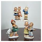 (4pc) HUMMEL PORCELAIN FIGURINES | Subjects include children with a cake, two children playing instr