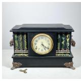 #3 E. INGRAHAM CO. CLASSICAL REVIVAL MANTEL CLOCK | Black wooden mantel clock with a central paper d