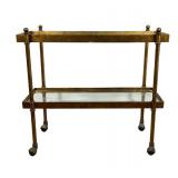 #10 GILT METAL AND GLASS TWO-TIER BAR CART | Two-tier gilt metal bar cart with rectangular inset gla