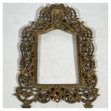 #16 FIGURAL CAST BRASS PICTURE FRAME | Cast brass openwork picture frame with scrolling foliate orna