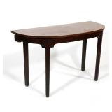 MAHOGANY DEMILUNE SIDE TABLE | Demilune (half-moon) mahogany top over a plain apron with bracketed r