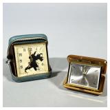 PAIR OF VINTAGE FOLDING TRAVEL ALARM CLOCKS, SMITHS 7 JEWELS AND UNMARKED GOLD-TONE | Lot of two fol