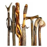 (7pc) GROUP OF HAND-CARVED WOODEN WALKING STICKS AND LEATHER-WRAPPED STAFF | Group of seven hand-car
