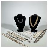 ASSORTED COSTUME NECKLACES | Group of costume necklaces and a pair of bangle-style bracelets display