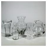 (5pc) ASSORTED CLEAR GLASS AND CUT CRYSTAL VASES, PITCHER AND LIDDED JAR | Group of five clear glass