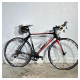 MEKK PINEROLO ROAD BICYCLE WITH SHIMANO COMPONENTS | This road bicycle features a black frame with r