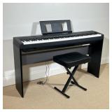 YAMAHA P-45 DIGITAL PIANO ON STAND WITH BENCH | Black Yamaha P-45 digital piano mounted on a matchin