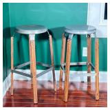 BLUE OCEAN TRADERS PAIR OF METAL-TOP AND WOOD BAR STOOLS | Pair of bar stools with round silver-gray