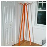 ORANGE PAINTED METAL TRIPOD COAT RACK | Orange-painted metal standing coat rack with three square-se