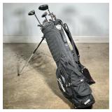 TITLEIST STAND GOLF BAG (SX56) WITH 11 ASSORTED GOLF CLUBS | Black Titleist stand golf bag labeled S