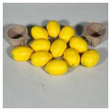TWO TERRACOTTA POTS WITH ELEVEN FAUX LEMONS | Two small unglazed terracotta pots with tied natural-f