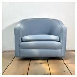 WEST ELM VIVIAN UPHOLSTERED SWIVEL ARMCHAIR | The armchair features a barrel-back silhouette upholst