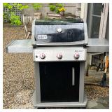 WEBER SPIRIT THREE-BURNER GAS GRILL WITH COVER | Weber Spirit gas grill featuring a black porcelain-