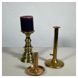 COLONIAL WILLIAMSBURG AND OTHERS TRIO OF ASSORTED BRASS CANDLESTICKS | A collection of three brass c