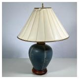 SLATE BLUE MATTE CERAMIC TABLE LAMP WITH INCISED BAMBOO DESIGN AND WOOD BASE | The lamp features a m