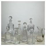 (8pc) Glass And Crystal Pitchers | Some have markings on the bottom Dimensions: h. 12 x dia. 4 in (d