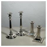 (4pc) TWO PAIRS OF SILVER-TONED METAL CANDLESTICKS | This collection includes a pair of tall candles