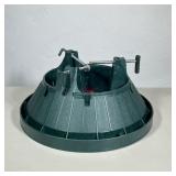 MOLDED PLASTIC CHRISTMAS TREE STAND | Dark green molded plastic Christmas tree stand with a circular