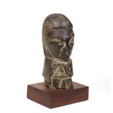 CARVED STONE SCULPTURE OF AN ETHNOGRAPHIC HEAD