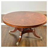 REGENCY STYLE MAHOGANY AND BURL VENEER PEDESTAL DINING TABLE | The circular mahogany tabletop featur
